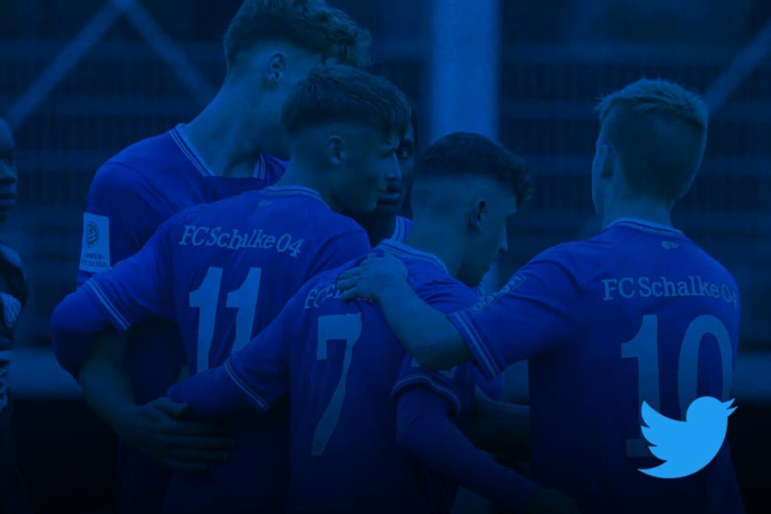 FC Schalke 04 soccer players celebrating together on the field.